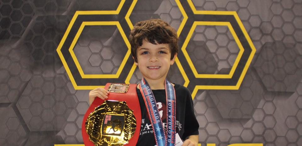 George holding champion belt
