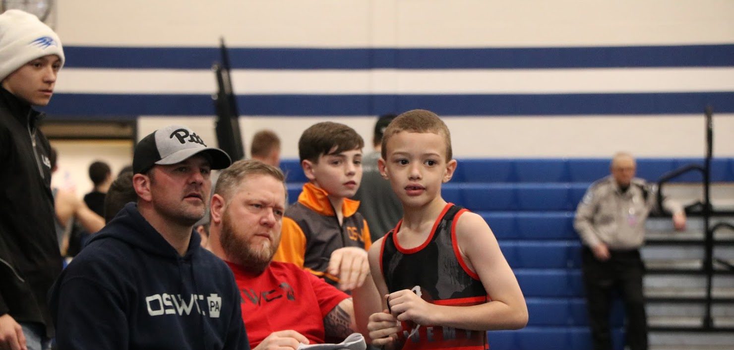 Wrestler talking to parent at PA King of the Mat Tournament